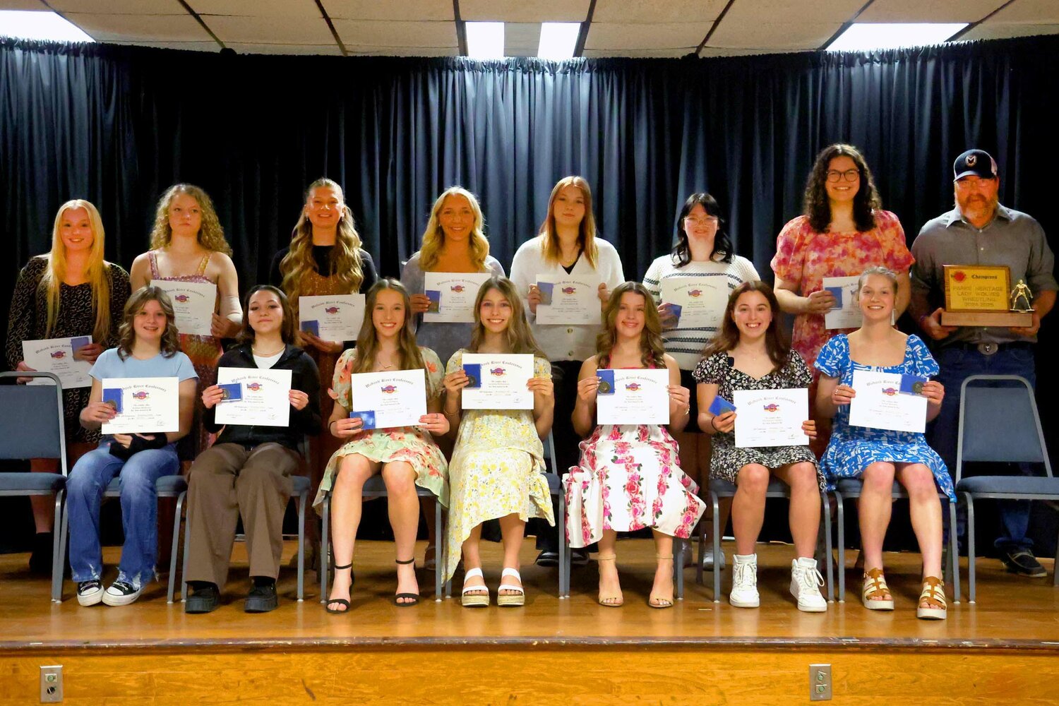 Members of the 2024-25 All-WRC girl’s wrestling team are, from left, front row, Kirklee Mullican (RP), Rheese Benjamin (PH), Lydia Perkins (FC), Savanna Richardson (FC), Kaidence Lyons (S), Mackenzie Gillogly (PH) and Joslyn Barnett (A); and back row, Aubrey Bates (S), Ruby Deel (FC), Emily Greene (S), Bailey Travioli (SV), Hope Richardson (SV), Maddi Crowder (PH) and Aubrey Bartkowiak (A).