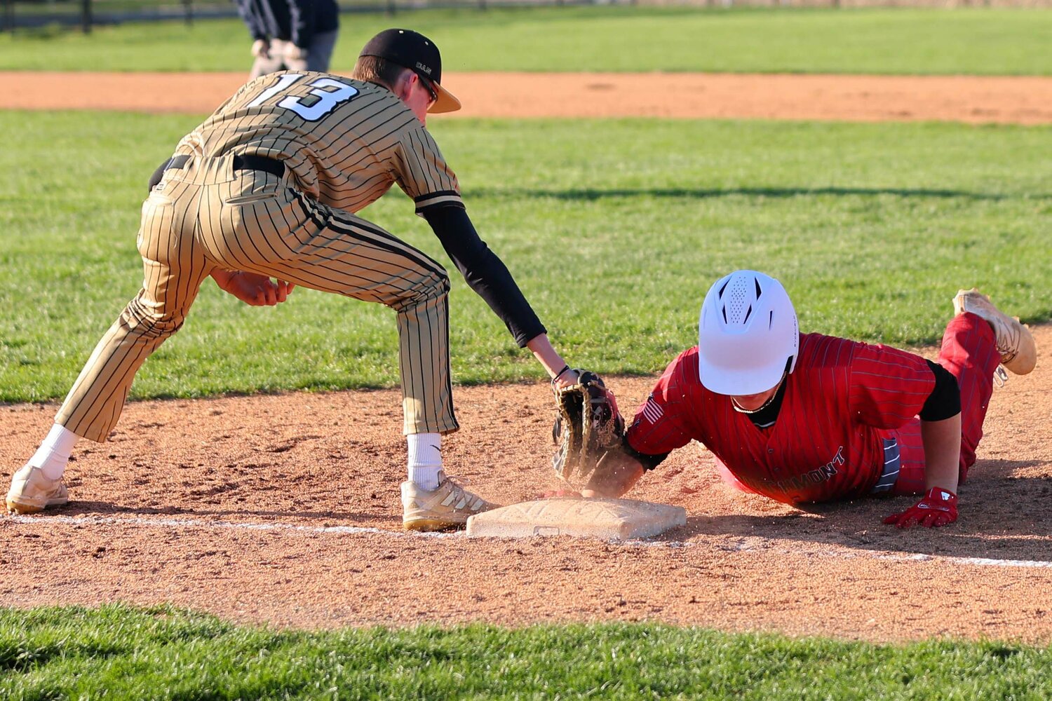Gunnar Shirk of Southmont dives back to first ahead of a tag try by Creux Rieman of Covington.
