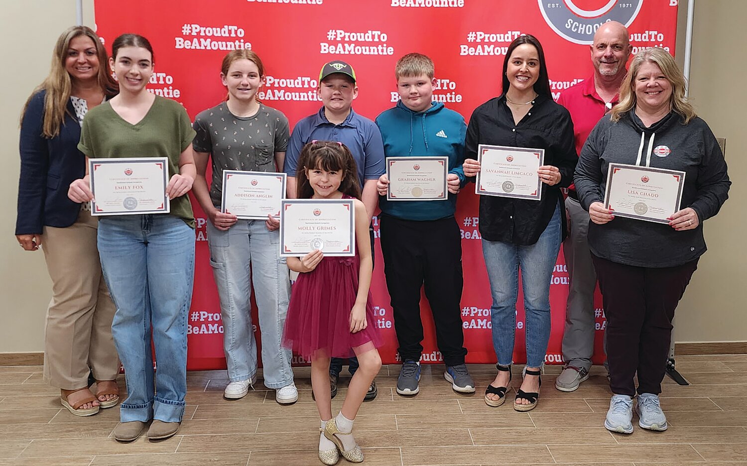 The board also recognized students and staff for March.