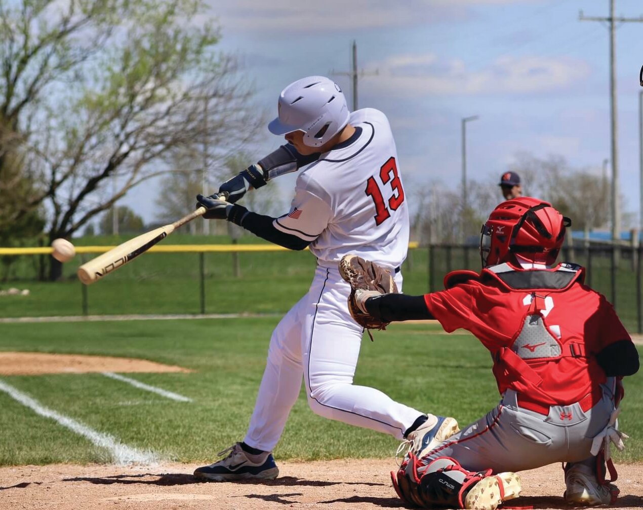 North's Cayden Keller swings at a pitch. Also pictures is South catcher Colton Cory.