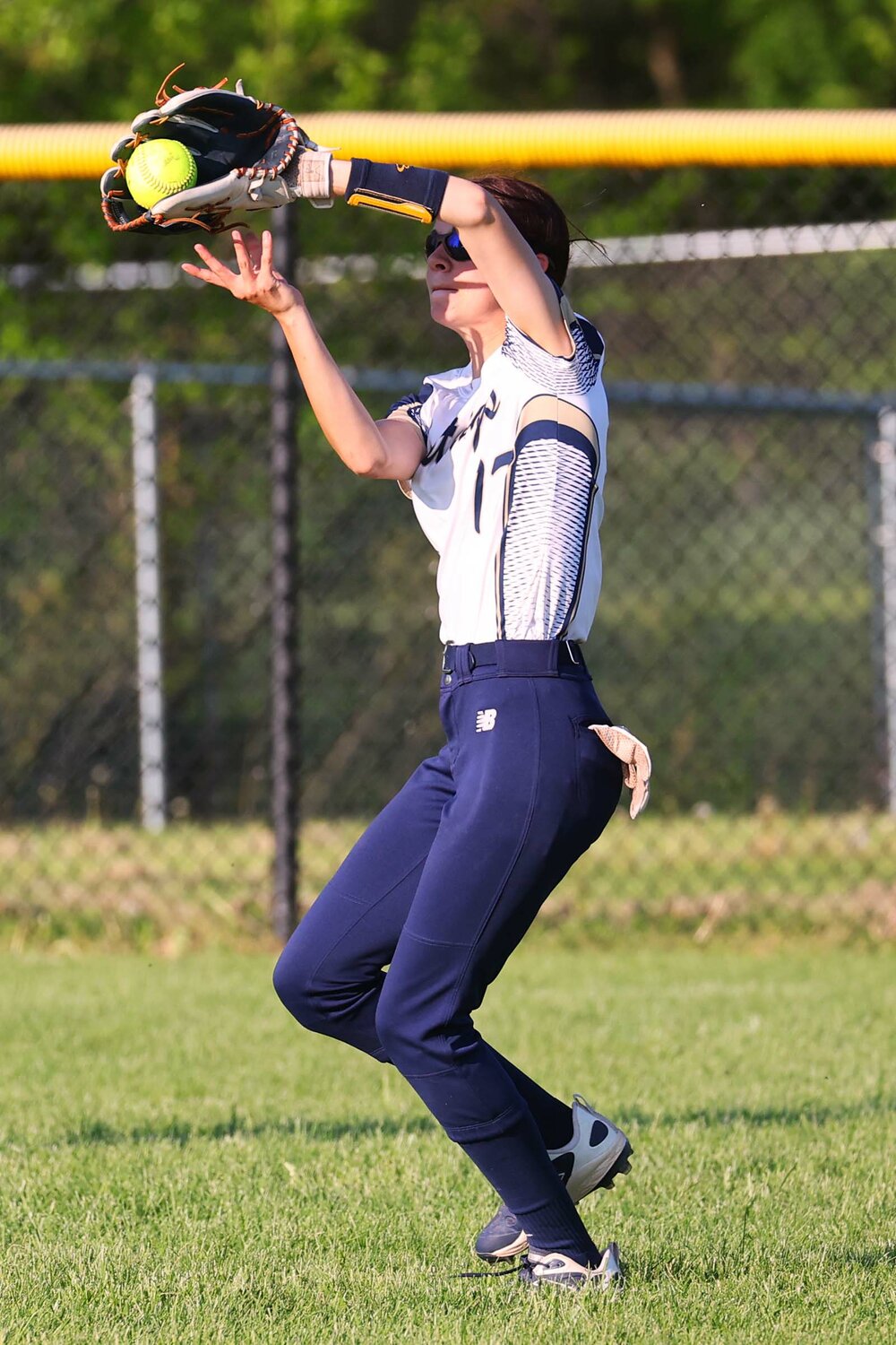 Kailey Daugherty of Fountain Central catches a fly ball in right field.