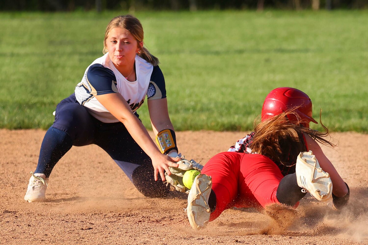 Mallory Massey of Fountain Central tags out Aleah Cruz of Attica at second base.
