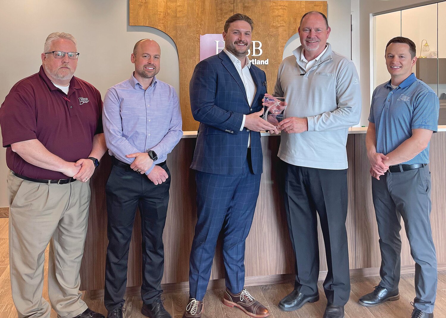 HHSB’s Five Star Member award from the Indiana Bankers Association are, from left, HHSB’s Trent Smaltz (CLO), Blake Zachary (CTO), Brad Monts (President and CEO), and Zach Hockersmith (CFO) with Ross Teare (IBA Vice President - Government Relations).