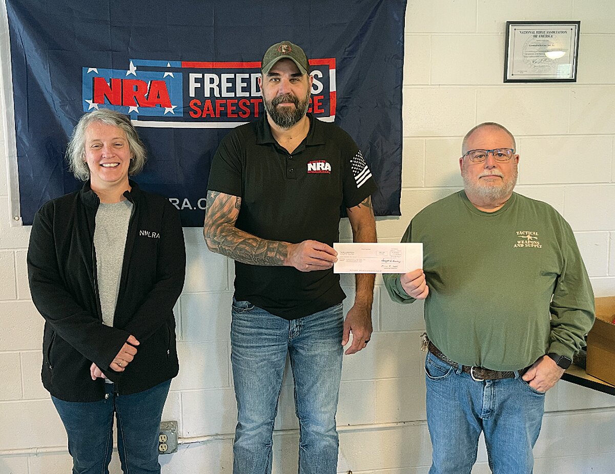 Matt Nelson, center, chairman of the Crawfordsville Friends of the NRA presented donations to Lori Roe, left, from the Montgomery County 4-H program, and Eric Small, right, of the Crawfordsville Gun Club. Roe received $5,100 for youth shooting sports and Small received $7,000 for youth training and shooting sports.