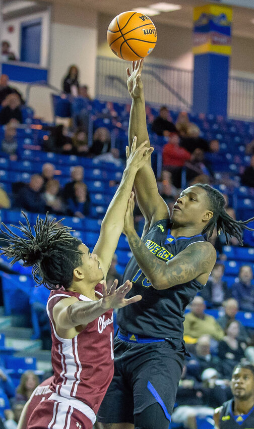 The Blue Hens' Jyare Davis goes up for a shot against Charleston on Thursday. SPECIAL TO THE DAILY STATE NEWS/MARK CAMPBELL.