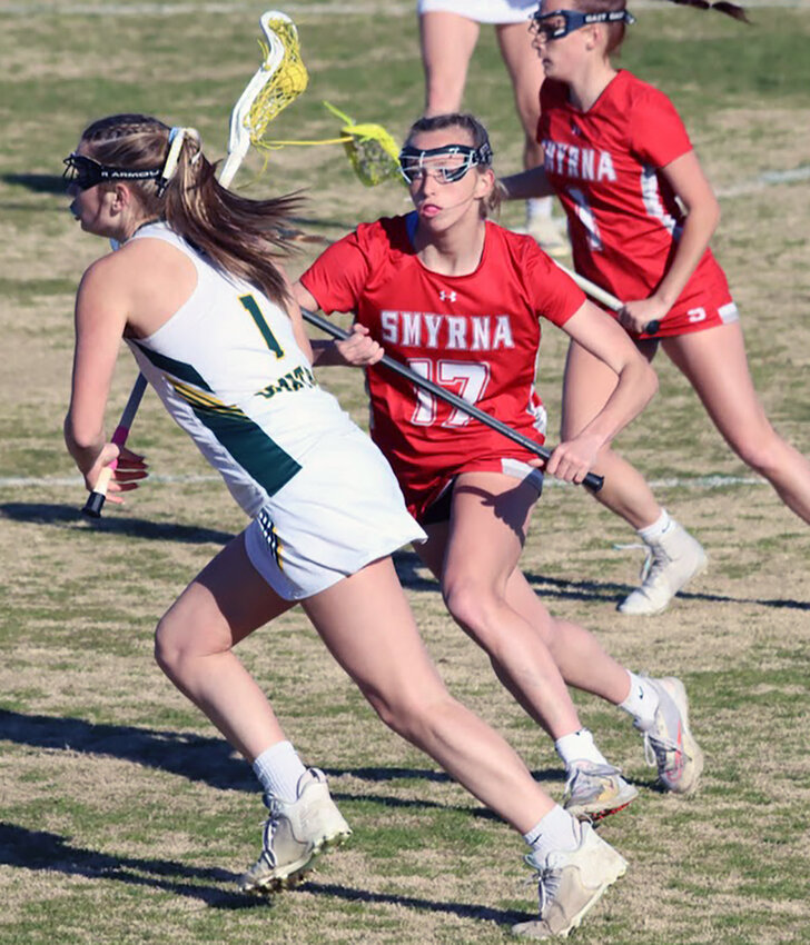 Ava Pierce (17) keeps an eye on a Spartans’ attacker in the Eagles’ win on Monday. Submitted photo/George Shogan