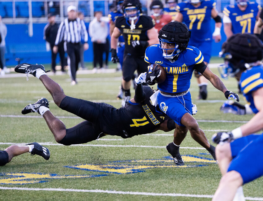 Delaware receiver JoJo Bermudez breaks away from A'Khoury Lyde after a catch on Friday night. DELAWARE ATHLETICS/MIKEY REEVES.
