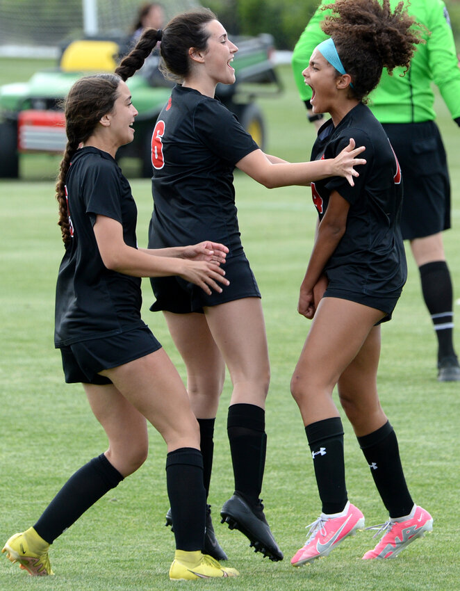 Freshman Sierra Henry of Polytech (right) celebrates with teammates Natalie Velazquez (left) and Julia Coleman after she scored a goal against Caesar Rodney last year. SPECIAL TO THE DELAWARE STATE NEWS/GARY EMEIGH