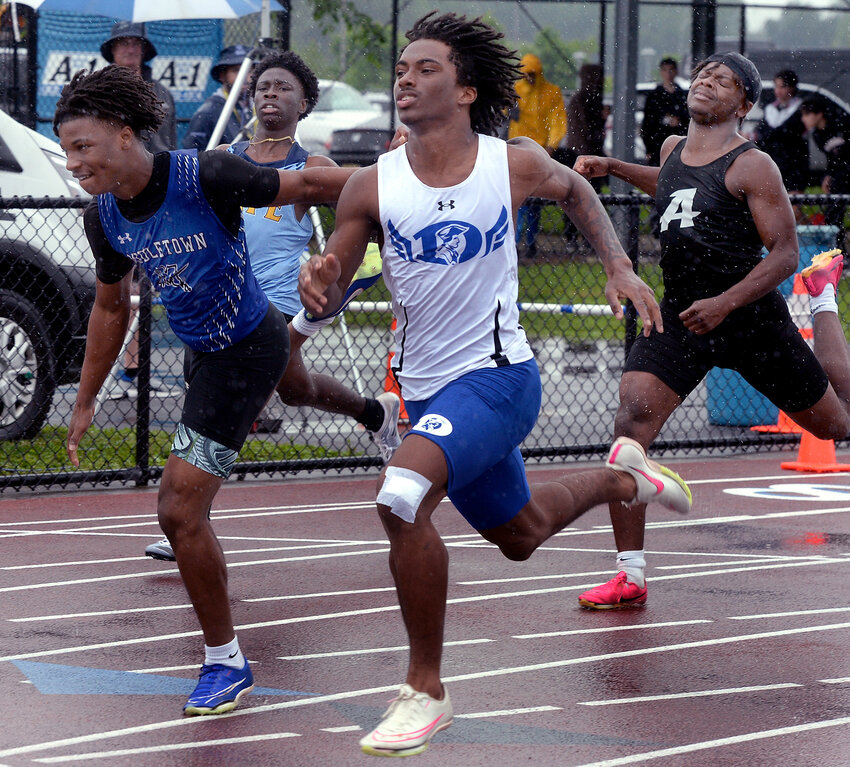 Photo taken a few yards from the finish line showing Jaheim Cole of Dover edging Middletown’s Anai Burney-Green by .3 of a second in the boys' Division I 100-meter dash finals Saturday. SPECIAL TO THE DAILY STATE NEWS/GARY EMEIGH