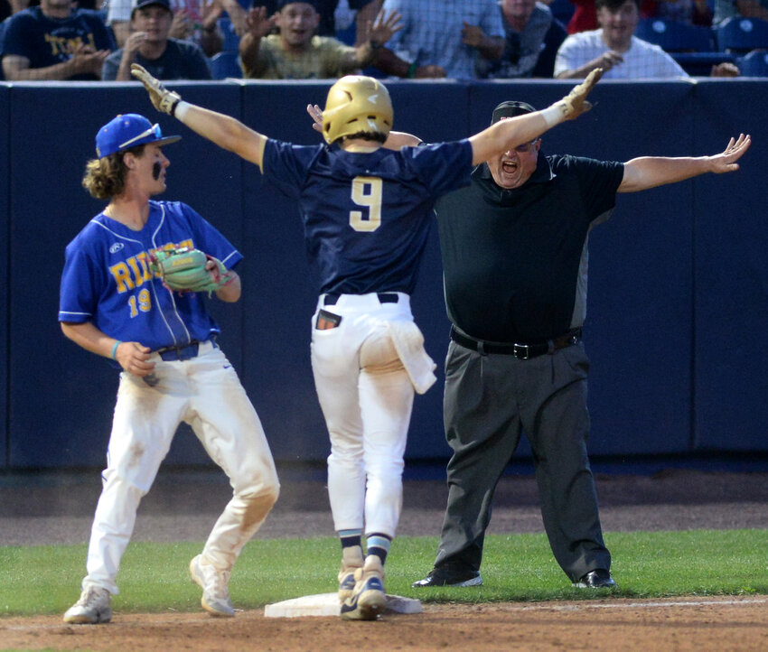Salesianum’s James Gray and the umpire appear to agree on the call that he stole third base safely in Saturday night’s DIAA state championship game with Caesar Rodney.  SPECIAL TO THE DAILY STATE NEWS/GARY EMEIGH