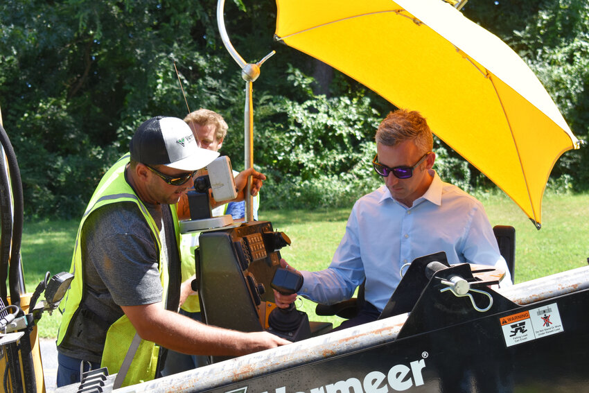 Secretary Day operates a drill, assisted by members of Simple Fiber. SALISBURY INDEPENDENT/RICHARD CAINES