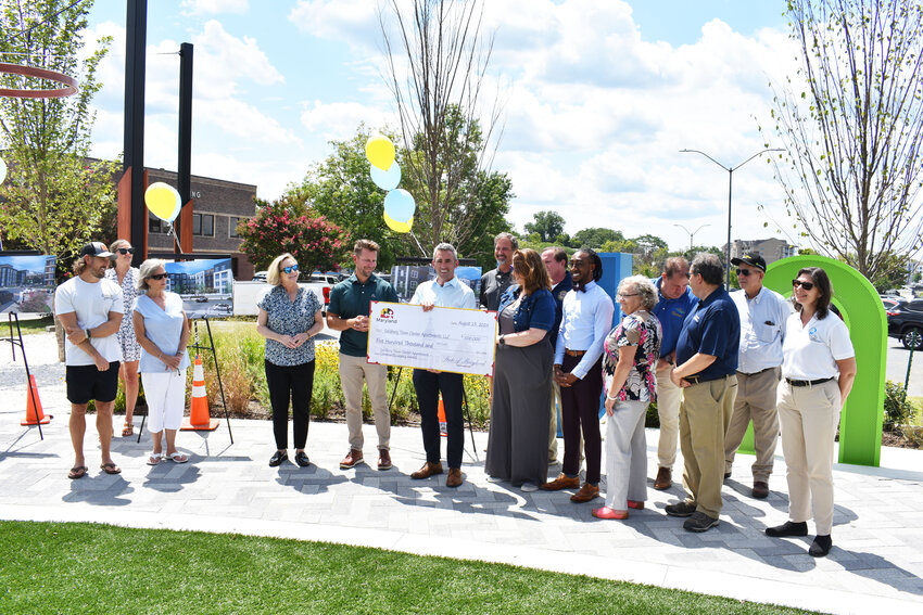 Secretary Day presents a check to Brad Gillis of Gillis Gilkerson. SALISBURY INDEPENDENT/RICHARD CAINES.