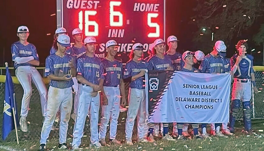 The Camden-Wyoming Senior League baseball all-stars pose with their District I championship banner. CAMDEN-WYOMING LITTLE LEAGUE PHOTO