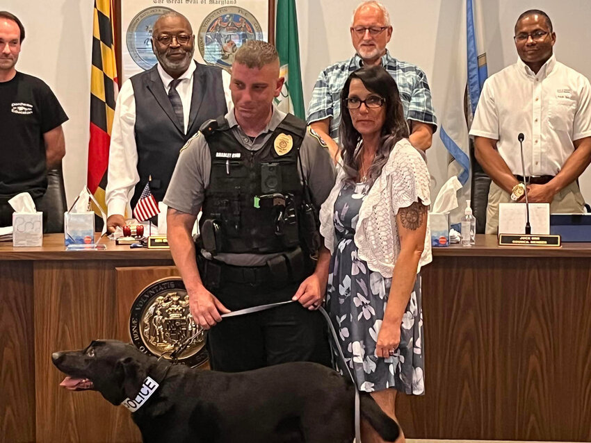 At the Hurlock Town Council meeting on June 12, Mayor Charles Cephas and members of the council recognized and honored Hurlock Police Department K-9 Marlee on her retirement. Marlee received a proclamation from Mayor Cephas and a plaque from the Hurlock Police Department. Marlee served from 2018 until May 31, 2023. She was not only an excellent detection office, but served as a great ambassador for the Hurlock Police Department and the Town of Hurlock, a statement from the town said. Marlee is seen with Officer Brandon Bradley and Jessie Bradley. Council Members from the left are David Higgins (District 1), Mayor Cephas, Earl Murphy (At Large), and Jock Orr (District 4).