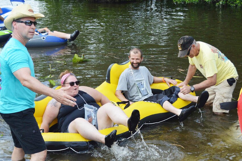Seaford City Manager Charles Anderson, left, and Nanticoke Riverfest volunteer Toby French set another Float-In entry in motion during Saturday's event.