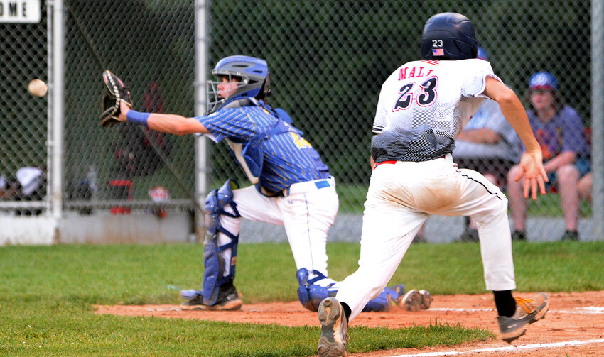 Camden-Wyoming catcher Ethan Wisler reaches for the ball as John Malloy of Naamans scores on a sacrifice fly in Friday night's Senior League baseball state tournament game. SPECIAL TO THE DELAWARE STATE NEWS/GARY EMEIGH