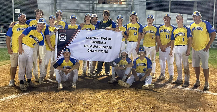 Photo courtesy of Hazzard Sports  The Mid-Sussex Sussex Senior League baseball team poses with its state championship banner on Tuesday night.
