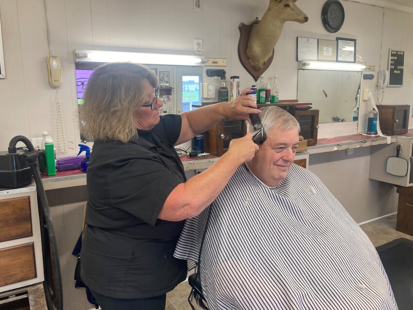 James Webster, from Dover, gets a haircut from stylist Debbie Lardieri in one of the four chairs at Buck&rsquo;s Barber Shop in west Dover last Wednesday.