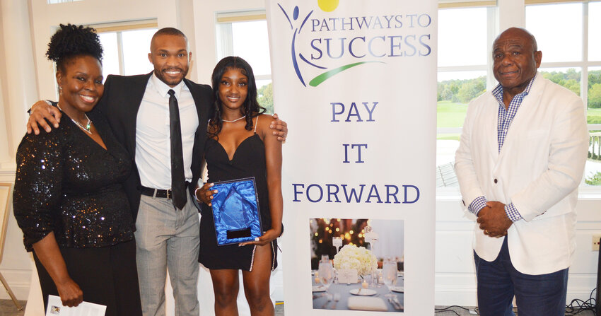 From left, Pathways to Success executive director Fay Blake, Seaford High School coordinator Michael Holland, 2023 Seaford graduate/student honoree Yarmilca Estimable and Patways to Success board president William Collick at the Jully 22 awards ceremony in Millsboro.