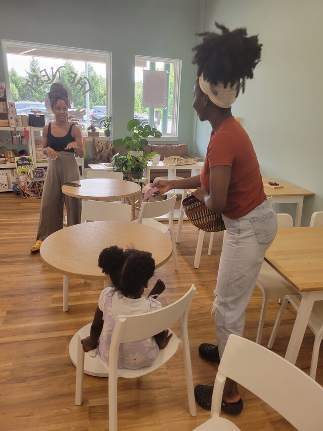 The Nest co-owner Ashley Rice, left, converses with patron Jemina Young of Bear. The play cafe in Middletown was recently awarded a $50,000 grant from the Delaware Division of Small Business.