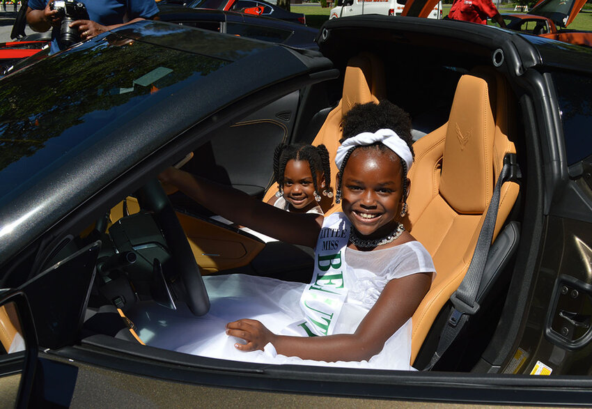 Mia Dale, 4, and 8-year-old My-Laav Nichols, both of Bridgeville, sit in the 2021 Corvette owned by Ed Walker of New Jersey. The Corvette was among the entries in AFRAM's 2022 Self Expression Car Show.