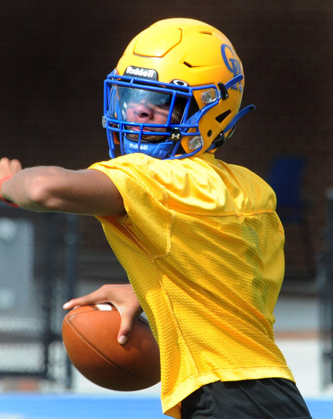 CR Junior quarterback Julius Timmons throwing short route passes Monday.  GARY EMEIGH/SPECIAL TO THE DELAWARE STATE NEWS