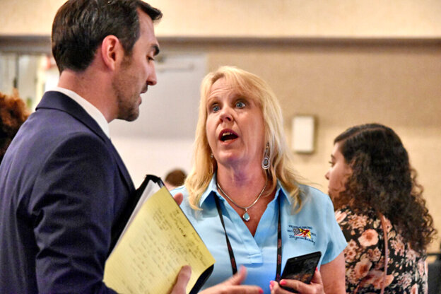 Federalsburg Mayor Kimberly Abner (right) speaks to Will Tilburg, acting director of the Maryland Cannabis Administration.