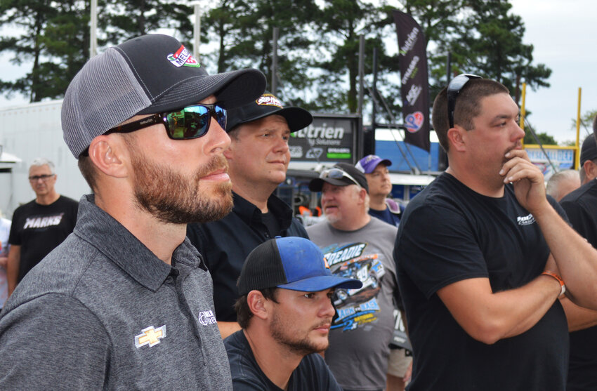 NASCAR star Ross Chastain, left, attends the driver's meeting prior to on-track action Thursday for the Melvin Joseph Memorial event at Georgetown Speedway. He competed in the Lucas Oil Late Model Dirt Series but did not qualify for the main feature. At right is Georgetown's Ross &quot;The Boss&quot; Robinson, a regular in the Lucas Oil Late Model Dirt Series who placed 11th.