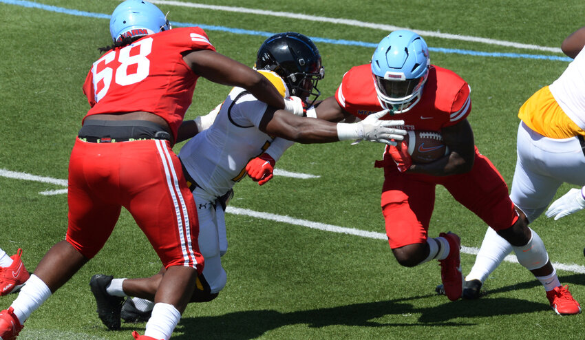 Delaware State&rsquo;s Marquis Gillis takes a handoff for a short gain against Bowie State Saturday. SPECIAL TO THE DELAWARE STATE NEWS/GARY EMEIGH