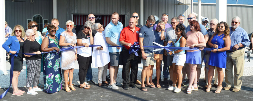 Owners and elected officials join Greater Georgetown Chamber of Commerce members Thursday for a ribbon cutting for Revelation Craft Brewing Co.'s Georgetown location.