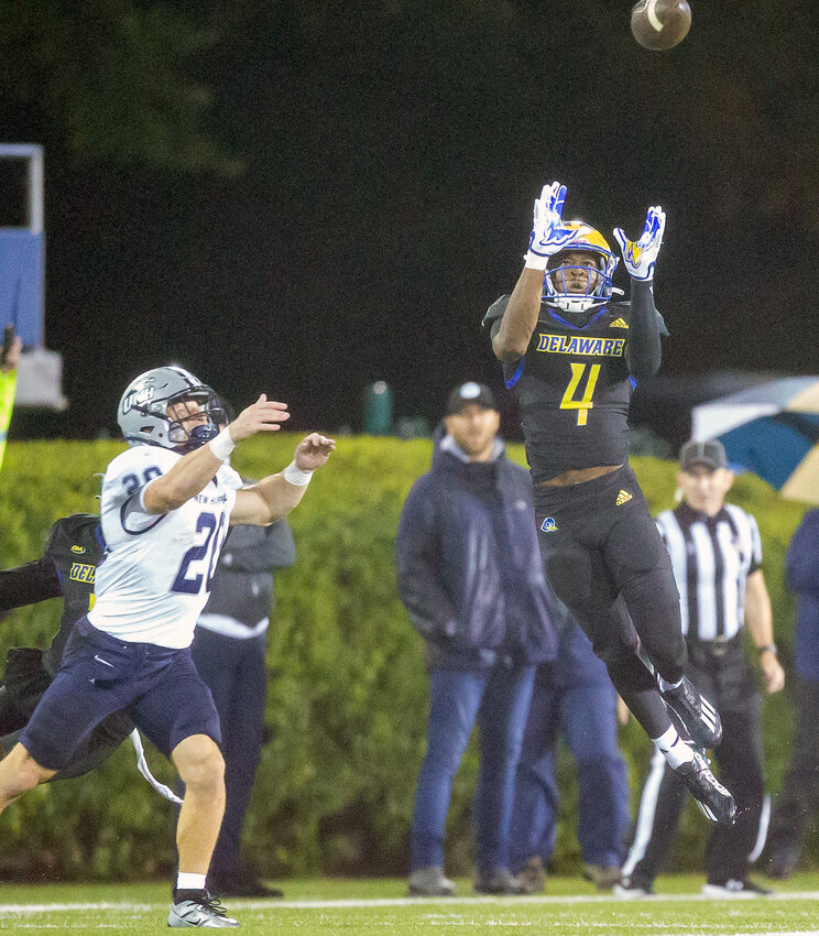 Delaware cornerback Khalil Dawsey, a transfer from Harvard, goes up for an interception in Saturday's win over New Hampshire. Special to the Delaware State News/Sarah Boekholder.