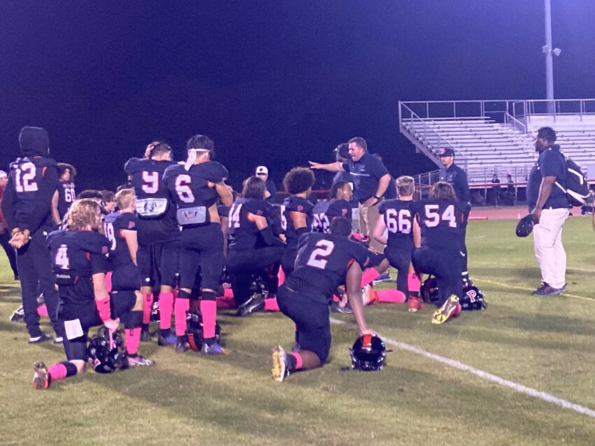 Polytech High School football coach David Eilers talks to his football team after it defeated Seaford 22-21 on Friday night, giving the Panthers their school-record seventh victory in a season.