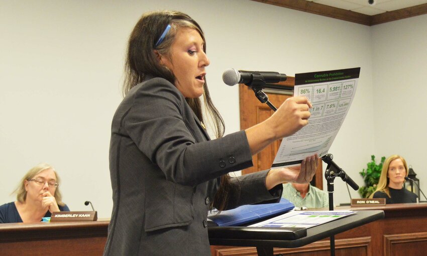 Zoe Patchell, a lobbyist and co-founder of the Delaware Cannabis Advocacy Network, shares data in support of allowing regulated marijuana business in Millsboro on Monday.