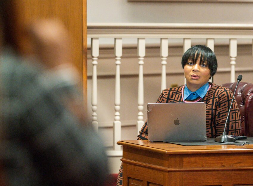 Fleur McKendell, president of Central Delaware NAACP, listens to a resident at a town hall meeting held at City Hall on Thursday. A series of ongoing discussions about race, policing, safety and complaints with city governance has sparked calls to empower the Human Relations Commission to help resolve community disputes.