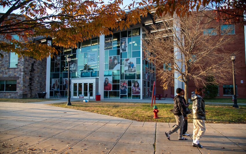 Students walk by the Martin Luther King, Jr. Student Center at Delaware State University on Nov. 11, 2023.