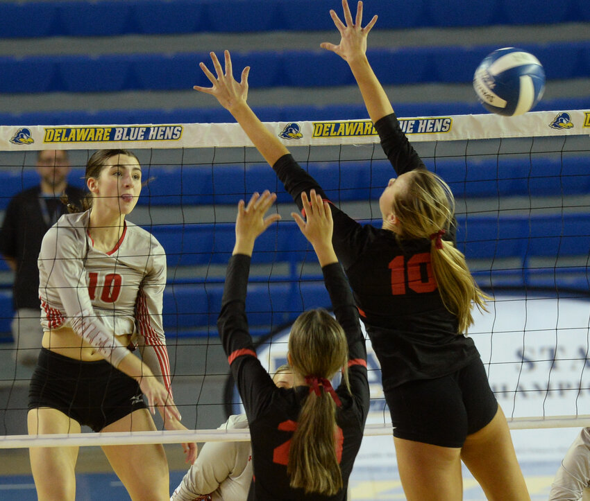 Smyrna's Anna Richardson gets a hit past Ursuline's defense in Thursday night's DIAA girls' volleyball state championship match at the Carpenter Center. SPECIAL TO THE DELAWARE STATE NEWS/GARY EMEIGH