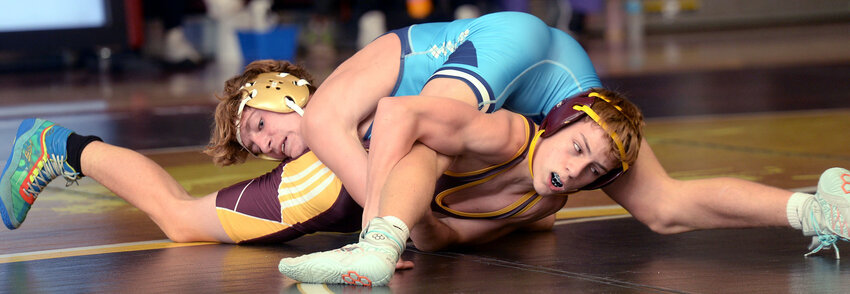 Kaiden Swain of the Buccaneers trying to escape from Cape Henlopen&rsquo;s Hudson Senard in the 120-pound match Wednesday night.  Swain won by decision 14-6.  SPECIAL TO THE DELAWARE STATE NEWS/GARY EMEIGH