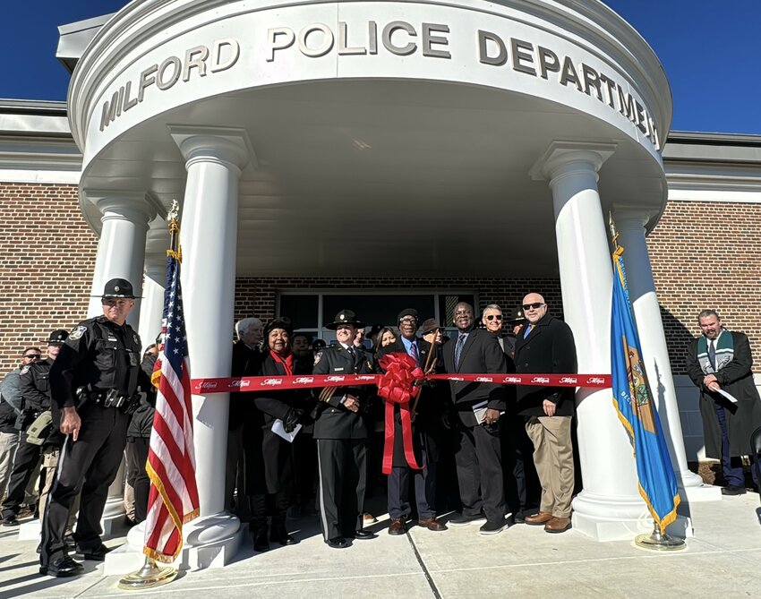 Milford Police Chief Cecilia Ashe, Mayor Archie Campbell and Vice Mayor Jason James prepare for the ribbon cutting Tuesday.