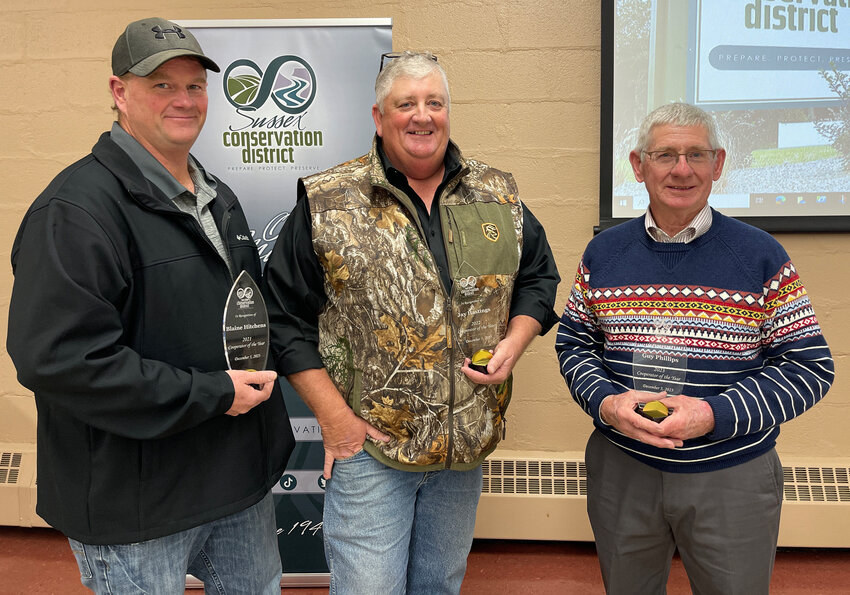 Cooperators of the Year, from left, 2021, Blaine Hitchens, of Laurel; 2022, Jay Hastings, of Delmar; and 2023, Guy Phillips, of Georgetown, were recognized at the Cooperators&rsquo; dinner held in Bridgeville Dec. 5.