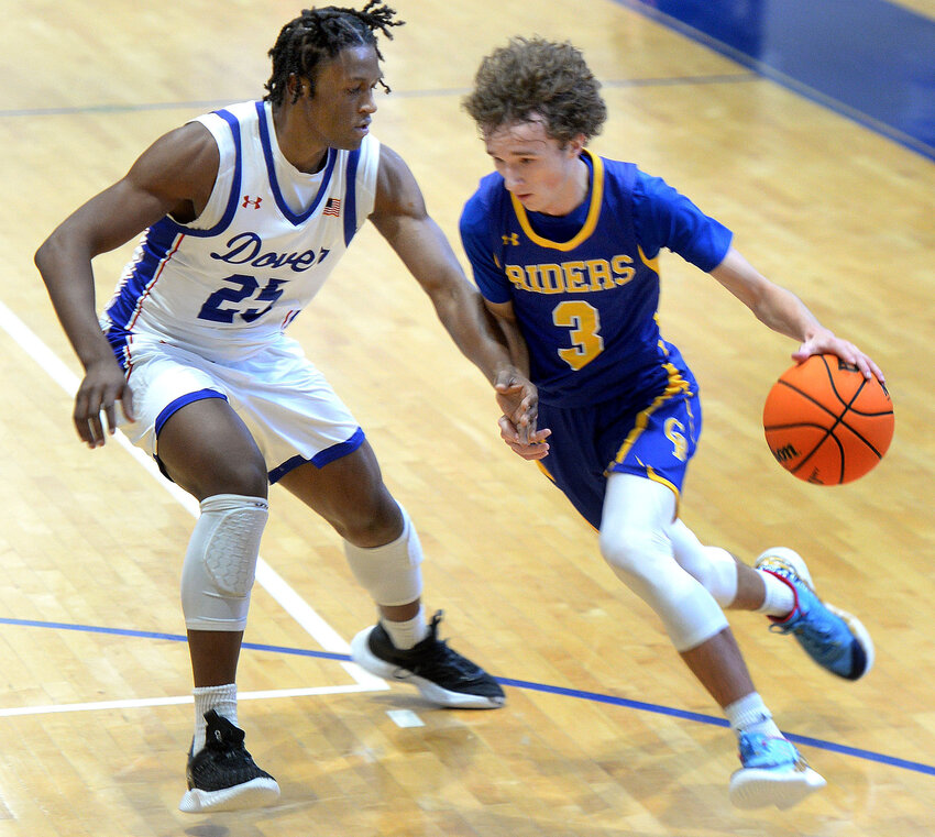 CR&rsquo;s Adam Bailey trying to advance the ball past Istavan Norwood of Dover in Saturday&rsquo;s game.  SPECIAL TO THE DAILY STATE NEWS/GARY EMEIGH