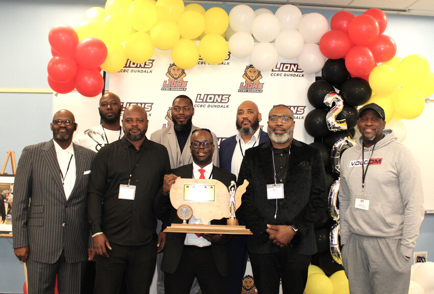 Cambridge native Richie White Jr., bottom row center, joined several former members of the 2000 Community College of Baltimore County at Dundalk Lions who won the NJCAA Division II National Championship. In a ceremony held Dec. 2 during the 2023 CCBC Athletics Hall of Fame Basketball Showcase, the team received Hall of Fame awards.