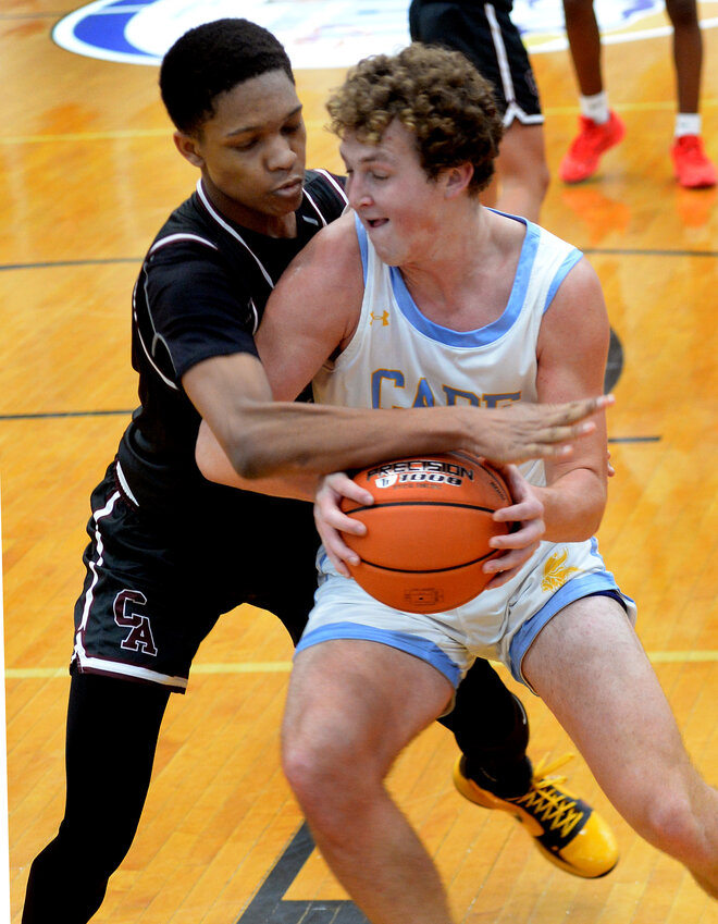 Caravel&rsquo;s Trevor Webster was called for a foul when he tried to pull ball away from Jack Schell of the Vikings Tuesday night.  SPECIAL TO THE DAILY STATE NEWS/GARY EMEIGH