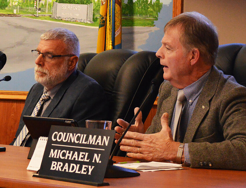Seaford City Councilman Mike Bradley, right, offers his opinion to a proposed motion on production and retail sales of marijuana during a meeting last November. At left is Councilman/Vice Mayor Dan Henderson, whose motion to side with federal regulations was approved Nov. 28 and Dec. 12.