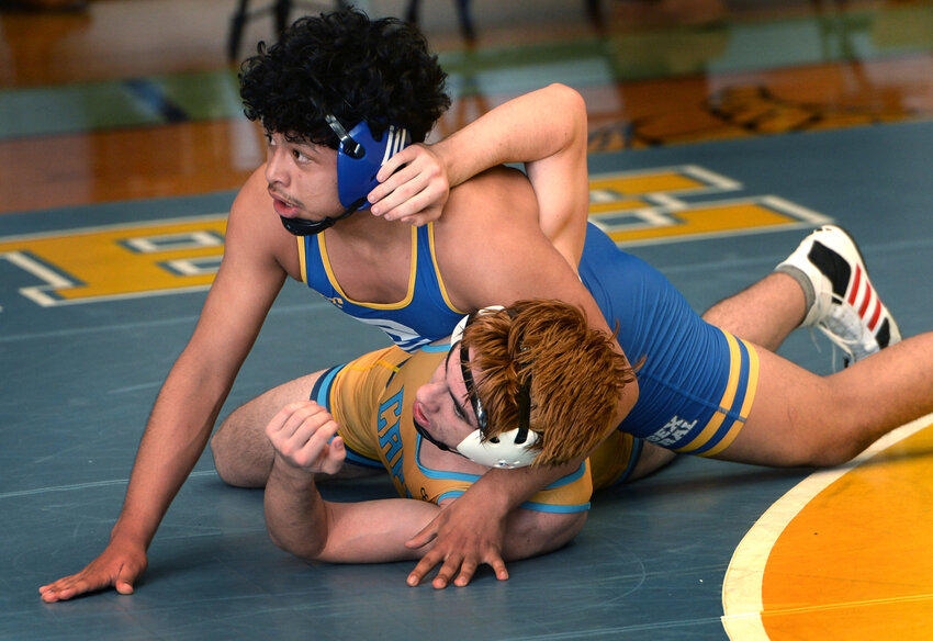 Cruz Mota-Martinez of Sussex Central checks time left on the clock in his match against Cape&rsquo;s Noah Daimond in the 165-pound bout.  The Golden Knight won by decision 3-1.  SPECIAL TO THE DAILY STATE NEWS/GARY EMEIGH