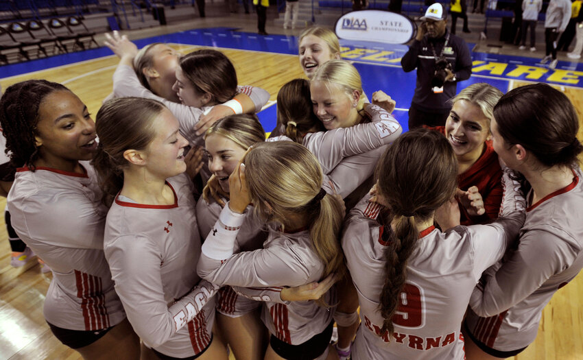 Smyrna High&rsquo;s girls&rsquo; volleyball players celebrate after becoming the first Downstate team to win the DIAA state title. Special to the Daily State News/Gary Emeigh