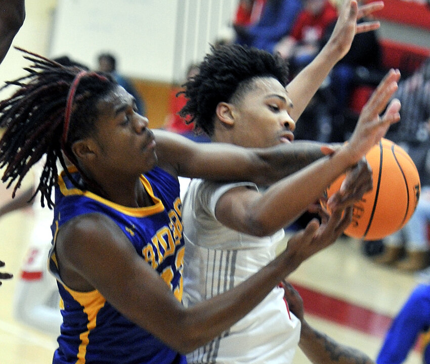 CR&rsquo;s Tai&rsquo;Shaun Allen trying to pull in a rebound from behind Jalen Williams of Smyrna.  SPECIAL TO THE DAILY STATE NEWS/GARY EMEIGH