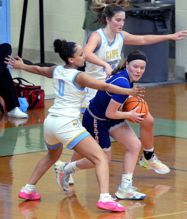 Dover's Ashtyn Torbert trying to get past Cape defenders Mya Maull (left) and Hayden Hudson in Thursday night's game in Lewes.  Torbert was key in Senators comeback 64-59 victory with three back-to- back baskets from 3-point range in the 4th quarter. SPECIAL TO THE DAILY STATE NEWS/GARY EMEIGH