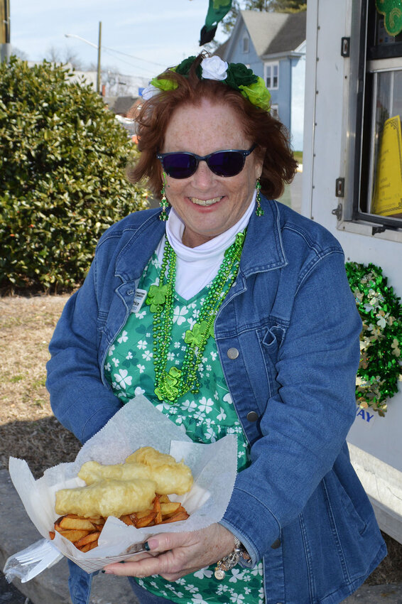 Linda Price, Greater Georgetown Chamber of Commerce president/CEO, opted for Fiona's Irish Fish &amp; Chips during the 2023 St. Patrick's Day Block Party in Georgetown.