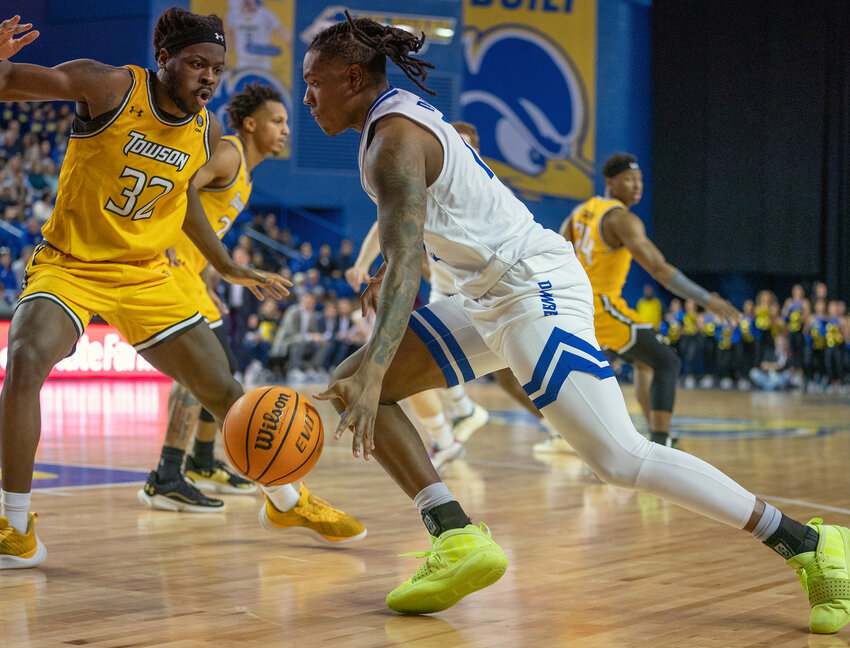 Jyare Davis, who finished with a team-high 18 points on Saturday, drives to the basket against Towson. DELAWARE ATHLETICS PHOTO/MIKEY REEVES.