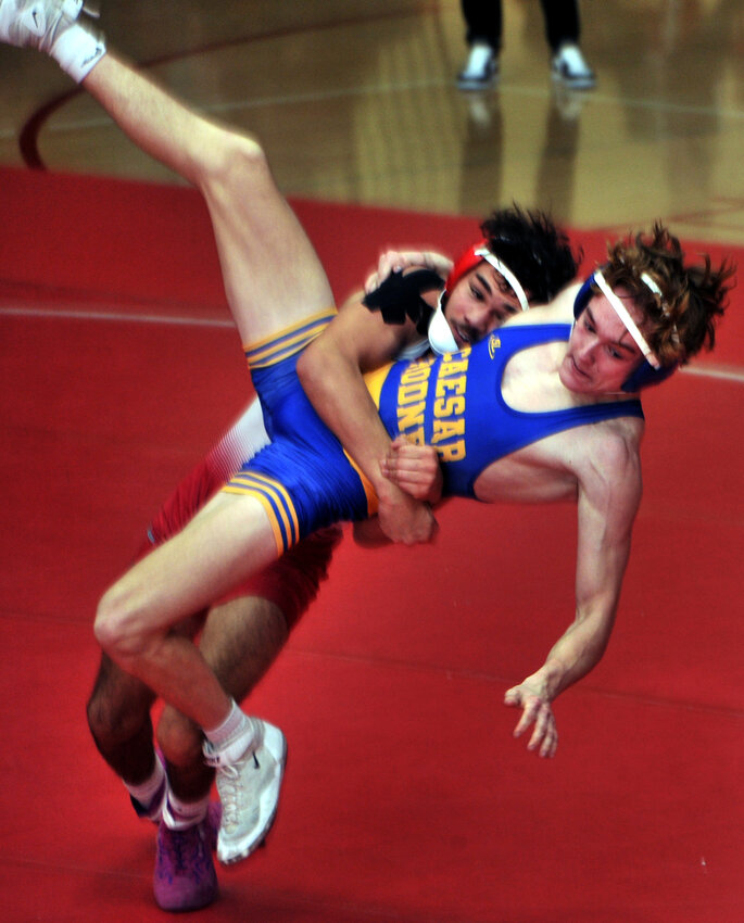 Braden Cole of Caesar Rodney braces for impact in the 138-pound match with Smyrna&rsquo;s Victor Hernandez Bryant.  Bryant won by major decision 15-6. SPECIAL TO THE DAILY STATE NEWS/GARY EMEIGH